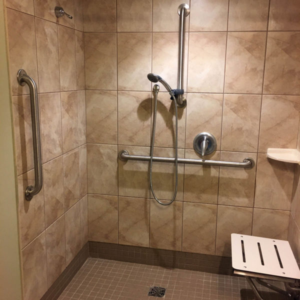 horizontal grab bar installer in shower wall
