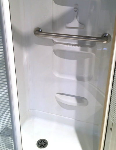grab bar installation in acrylic shower